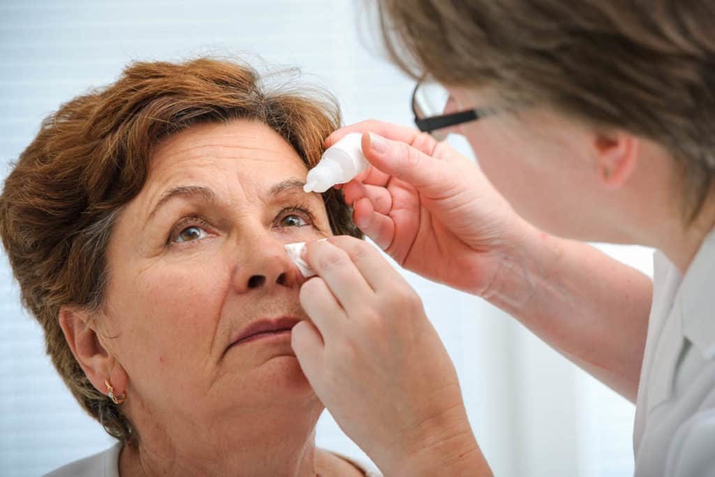 lady having her eye inspected